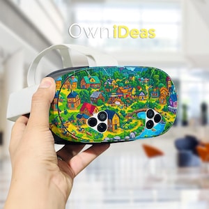 May include: A VR headset with a colorful village scene design. The headset features a white strap and a black front panel with a vibrant illustration of houses, trees, and a river. The text "OwniDeas" is visible in the background.