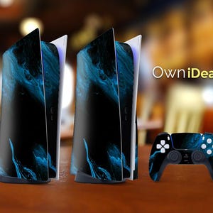 May include: Two black and blue PlayStation 5 consoles with a matching black and blue controller. The consoles have a swirling blue and black design.