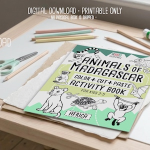 May include: A colorful activity book titled "Animals of Madagascar" with illustrations of various animals. The book is designed for kids aged 3-5 and includes color, cut, and paste activities. Pencils, scissors, and other art supplies are also visible.
