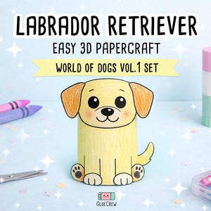 Pu&ograve; includere: Una figura di carta 3D di un Labrador Retriever giallo con occhi e naso neri, seduto. Il testo recita LABRADOR RETRIEVER EASY 3D PAPERCRAFT WORLD OF DOGS VOL.1 SET. Sono visibili forbici rosa, pastelli viola e una colla stick.