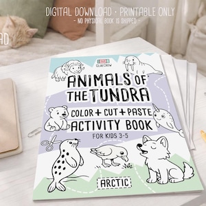 May include: A children's activity book titled "Animals of the Tundra" with illustrations of arctic animals. The book includes the text "Color + Cut + Paste Activity Book" and is designed for kids ages 3-5. The book is on a white surface.