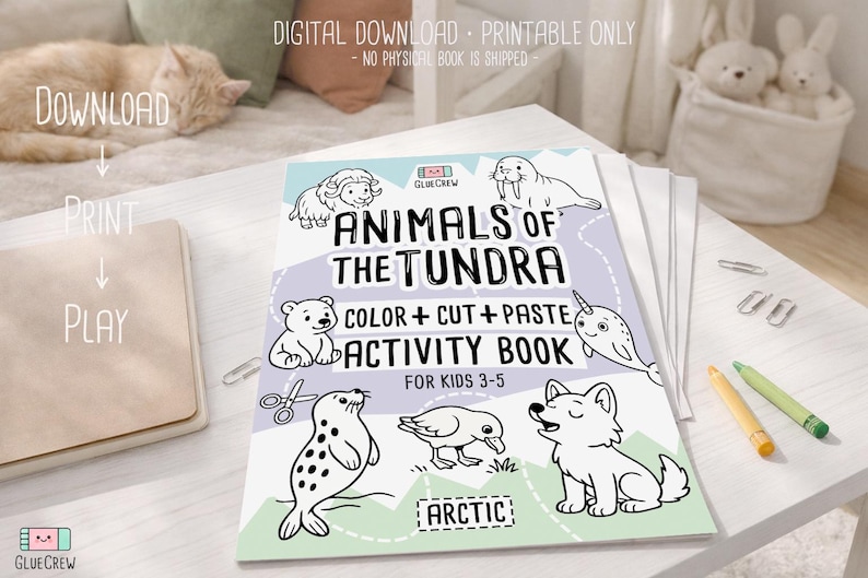 May include: A children's activity book titled "Animals of the Tundra" with illustrations of arctic animals. The book includes the text "Color + Cut + Paste Activity Book" and is designed for kids ages 3-5. The book is on a white surface.
