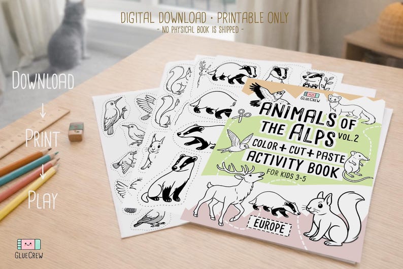 Printable “Animals of the Alps Vol. 2” color, cut-and-paste activity book cover shown with sample black-and-white alpine animal pages on a wooden desk with colored pencils, labeled as a digital download, printable only.