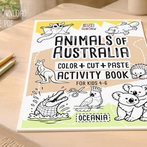 Printable “Animals of Australia” color, cut-and-paste activity book cover for kids ages 4–6, shown on a wooden desk with illustrated Australian animals and labeled as an instant digital download PDF.