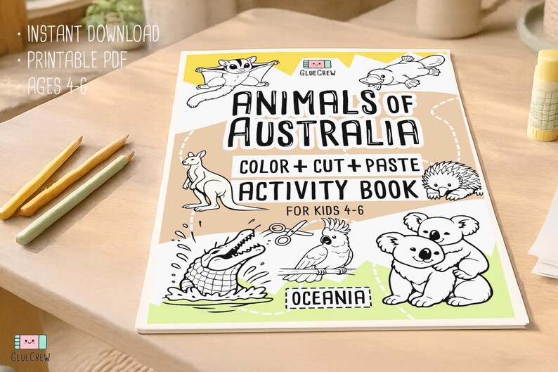 Printable “Animals of Australia” color, cut-and-paste activity book cover for kids ages 4–6, shown on a wooden desk with illustrated Australian animals and labeled as an instant digital download PDF.