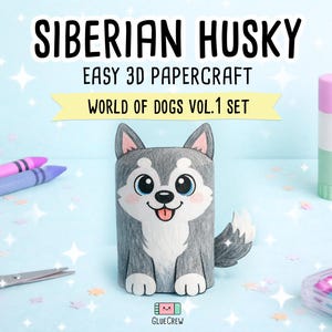 Pu&ograve; includere: Una figura di carta di un Husky siberiano con pelo grigio e bianco, occhi grandi e lingua rosa. Il testo recita SIBERIAN HUSKY EASY 3D PAPERCRAFT WORLD OF DOGS VOL.1 SET. La scena include pastelli viola, forbici rosa e uno stick di colla.