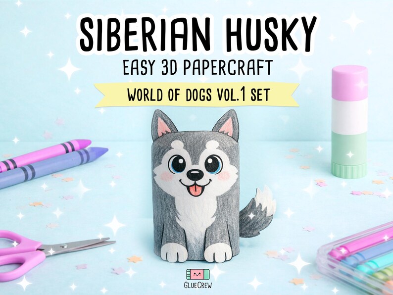 Pu&ograve; includere: Una figura di carta di un Husky siberiano con pelo grigio e bianco, occhi grandi e lingua rosa. Il testo recita SIBERIAN HUSKY EASY 3D PAPERCRAFT WORLD OF DOGS VOL.1 SET. La scena include pastelli viola, forbici rosa e uno stick di colla.