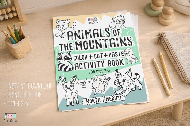 May include: A children's activity book titled "Animals of the Mountains" with illustrations of mountain animals. The cover features a raccoon, deer, and lynx. The book is designed for kids ages 3-5 and includes the text "Color + Cut + Paste Activity Book".