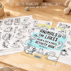 Digital download printable “Animals of the Lakes” color, cut-and-paste activity book for kids 3–5, shown with cover and sample black-and-white animal pages spread on a wooden desk with crayons.