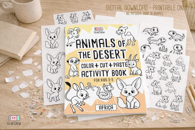 Printable “Animals of the Desert” color, cut-and-paste activity book cover shown with sample black-and-white desert animal pages spread on a wooden desk, labeled as a digital download with no physical book shipped.