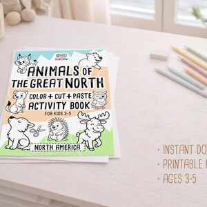 Pode incluir: Um livro de atividades intitulado "Animais do Grande Norte" com ilustra&ccedil;&otilde;es de animais norte-americanos. O livro foi concebido para crian&ccedil;as dos 3 aos 5 anos e inclui atividades de colorir, recortar e colar. L&aacute;pis de cor e outros materiais est&atilde;o sobre a mesa.