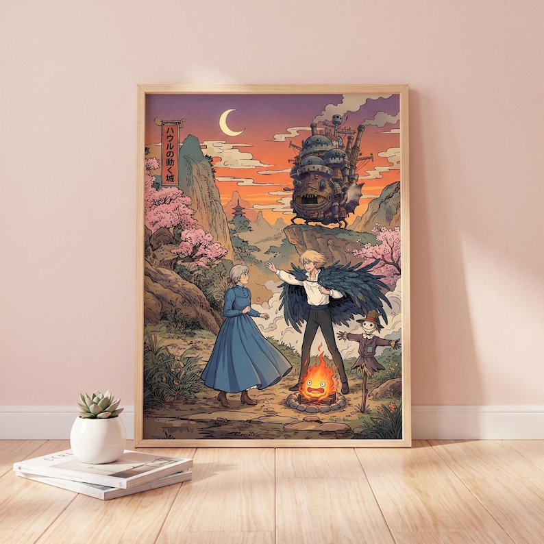 May include: A framed art print featuring a scene from a Japanese animated film. The artwork depicts characters in a fantasy landscape with a castle, a bonfire, and a crescent moon in the sky. The color palette includes shades of orange, pink, and blue.