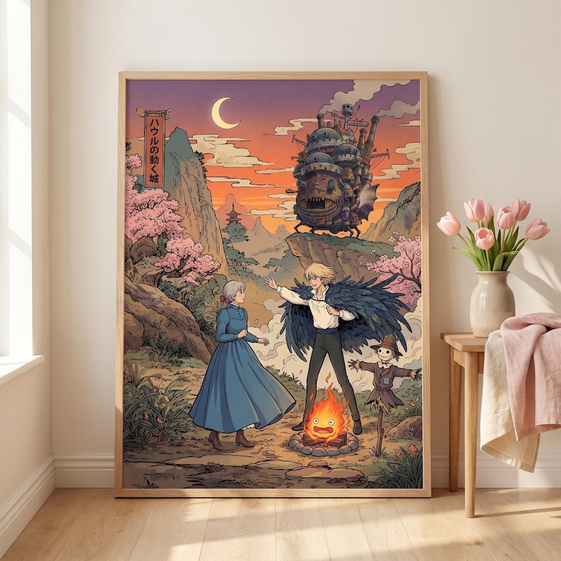 May include: A framed art print featuring a scene from "Howl's Moving Castle." The artwork depicts characters in a vibrant landscape with a castle, mountains, and a bonfire. Japanese text is visible in the upper left corner. The color palette includes shades of blue, orange, and pink.