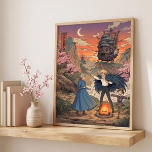 May include: A framed art print featuring a scene from the animated film, Howl's Moving Castle. The artwork depicts characters in a fantasy landscape with a castle, a bonfire, and Japanese text. The color palette includes shades of orange, pink, and blue.