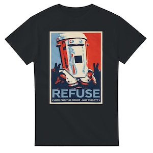 May include: A black short-sleeve t-shirt featuring a graphic print of a trash can character making peace signs. The design uses red, white, and blue colors with the text "REFUSE" and "VOTE FOR THE COUNT - NOT THE C**T" printed below the character.