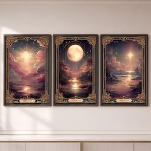 May include: Three framed rectangular wall art prints featuring celestial themes. The left print shows a bright sun over a landscape, labeled THE SUN. The center print depicts a full moon over water, labeled THE MOON. The right print shows a star, labeled THE STAR.