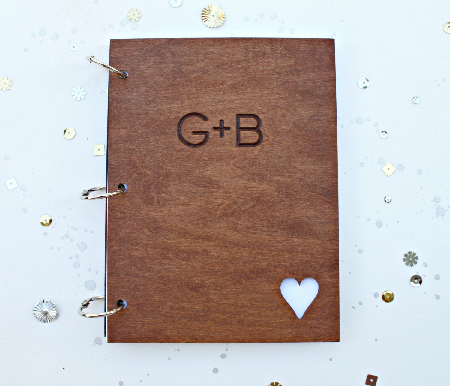 Custom wedding guest book with engraved initials and heart cutout