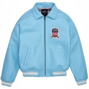 May include: Light blue leather jacket with a zip-up front, collar, and a ribbed hem and cuffs with white stripes. Features a patch on the chest with the text "AVIREX" and a patriotic design.