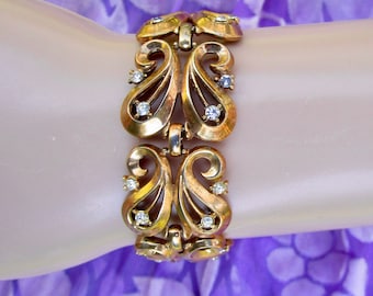 intricate Trifari link bracelet with clear crystal accents ... lyrical gold tone ... vintage 1930s, 1940s, signed &quot;Trifari pat pend&quot;