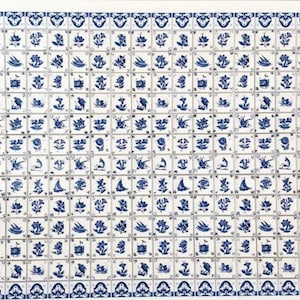 May include: A rectangular grid of white ceramic tiles featuring blue hand-painted illustrations of various flowers, birds, and sailboats. Each square tile displays a distinct motif, arranged in a repeating pattern with a decorative border.