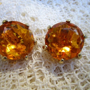 brilliant yellow-orange glass clip-on earrings, midcentury, in pronged gold-tone settings ... sunshine on your earlobes