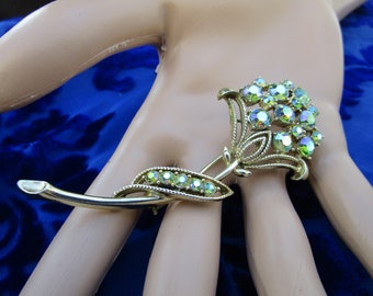 ethereal AB flower brooch signed by Coro ... 1950s, 1960s, blue shimmering stones in light gold tone, 3 inches long