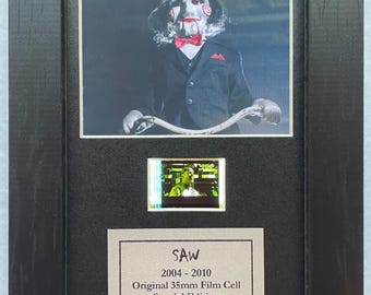 Saw original mini 35mm film cells set within quality wood frame + coa