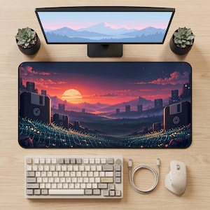 May include: A rectangular desk mat featuring a pixel art landscape of a sunset over mountains with large floppy disks integrated into the terrain, accompanied by a mechanical keyboard, a wireless mouse, and a charging cable on a light wood surface.