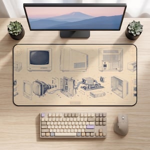 May include: A rectangular desk mat featuring a detailed technical blueprint illustration of a vintage computer. The design displays the front, side, and rear views of the monitor, along with an exploded view of the internal components and circuitry.