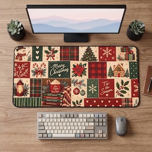 May include: A rectangular desk mat featuring a patchwork design with various Christmas motifs including a snowman, candy canes, a gingerbread house, a mug of hot cocoa, and text reading Merry Christmas and Tis the Season in red, green, and cream.