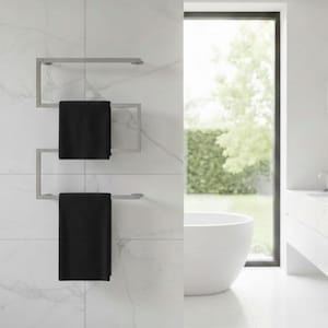 May include: A modern, stainless steel towel warmer with two black towels hanging on it. The towel warmer is mounted on a white tiled wall. The bathroom has a large window and a white bathtub.