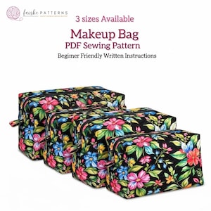 May include: Four black makeup bags with a colourful floral design featuring pink, blue, and yellow flowers and green leaves. The bags have a zip closure and a small handle. Text on the image reads "Makeup Bag PDF Sewing Pattern".