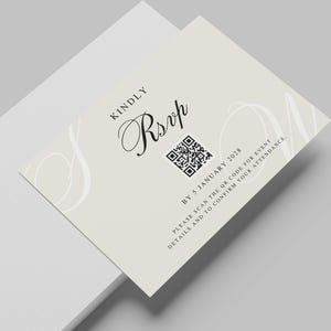May include: A light beige RSVP card with elegant script. The word "RSVP" is in a stylish font, with a QR code below it. The text "Kindly" is above the RSVP, and other text is below the QR code. The card is angled.