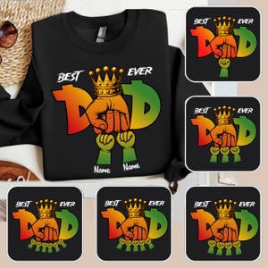 May include: Black sweatshirt with a colorful "Best Dad Ever" graphic. The design features a crown, a fist, and the word "Dad" in orange and green. Includes space for custom names below the graphic.