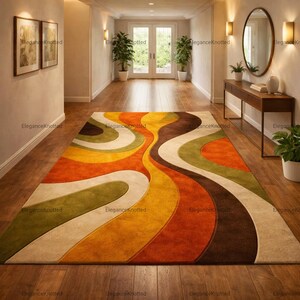 May include: A colorful area rug with a retro design. The rug features wavy stripes in shades of orange, yellow, green, brown, and cream. The rug is placed on a wooden floor in a hallway.