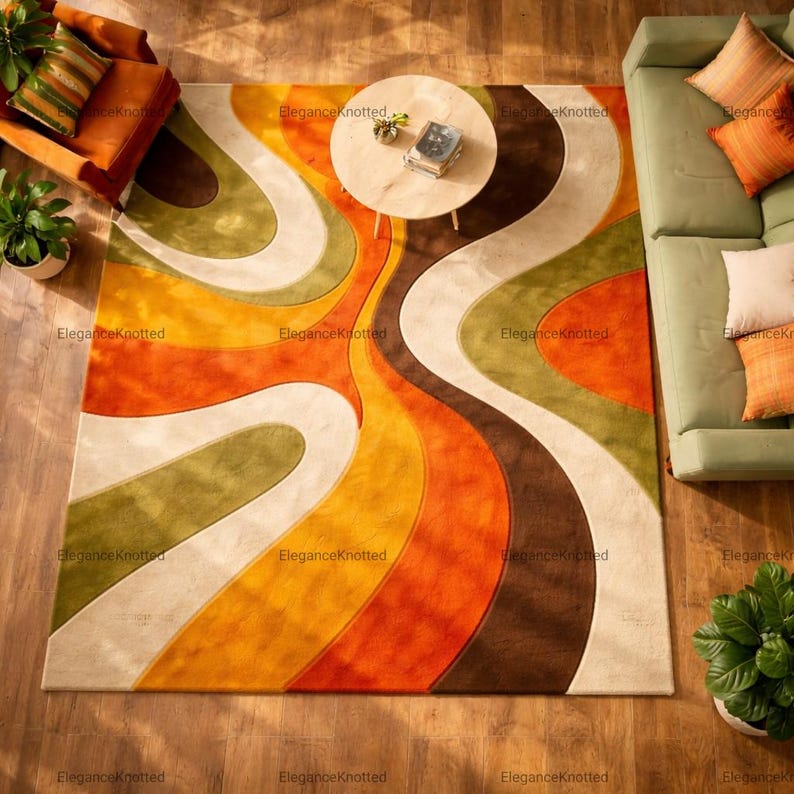 May include: A retro-style area rug with a flowing, abstract design in shades of orange, brown, yellow, green, and cream. The rug is placed on a wooden floor, with furniture visible around it.