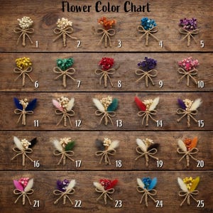 May include: A wooden surface displays a "Flower Color Chart" with 25 small, decorative floral arrangements. Each arrangement features dried flowers in various colours, tied with twine. The colour options include white, orange, blue, purple, and more.