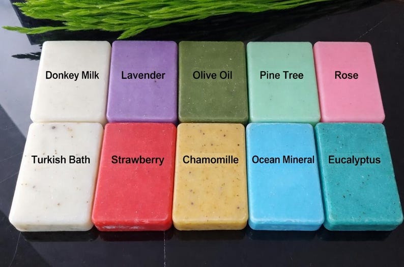 May include: Ten rectangular soaps in a variety of colours, each labelled with a different scent. Scents include Donkey Milk, Lavender, Olive Oil, Pine Tree, Rose, Turkish Bath, Strawberry, Chamomile, Ocean Mineral, and Eucalyptus.