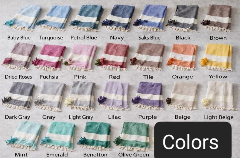 May include: A collection of colorful, folded Turkish towels, each with a white stripe and fringe. Colors include baby blue, turquoise, navy, black, brown, pink, red, orange, yellow, and more. The word "Colors" is displayed in a black rectangle.