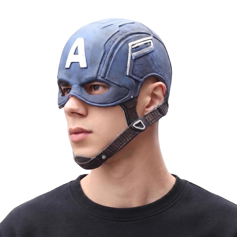 May include: A blue Captain America helmet with the letter "A" on the forehead. The helmet has a chin strap and eye openings. The helmet is a replica of the one worn by the superhero.