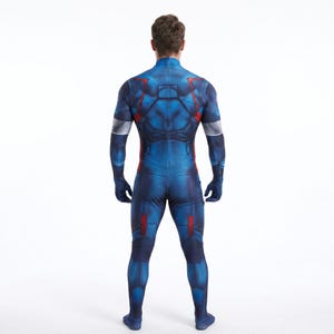 May include: A blue and red full-body costume with a high collar. The costume features a detailed design with red and silver accents. The wearer is seen from the back, showcasing the suit's form-fitting design and color scheme.