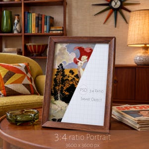 May include: A rectangular wooden picture frame containing a split image. The left side shows a stylized illustration of a figure with a red cape near trees and a yellow sky. The right side features a white grid with the text PSD 3:4 RATIO SMART OBJECT.