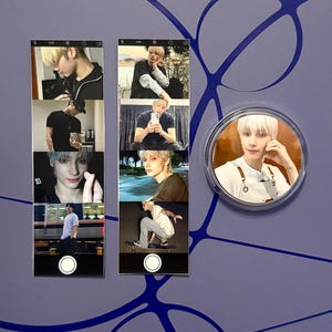 May include: A set of photo booth strips and a round button featuring a person with blonde hair. The photo strips show various images of the person in different settings. The button has a clear plastic cover and a metal backing. The background is a solid purple color.