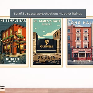 May include: Set of three framed Dublin, Ireland art prints. Each print features a different iconic location: The Temple Bar, St. James's Gate Brewery, and The Long Hall. The prints have a vintage travel poster style with vibrant colors.