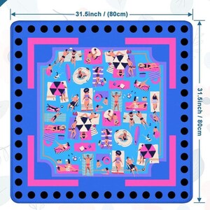 May include: A square beach mat, 31.5 inches (80 cm) on each side, featuring a vibrant illustration of people sunbathing. The mat has a blue border with black circles, a pink inner frame, and a light blue central design with beachgoers.