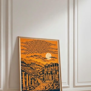 May include: Framed art print featuring a stylized illustration of the ancient city of Ephesus. The artwork depicts ruins, a sunset, and the word "EFES" in bold letters. The color palette includes orange, blue, and brown tones.