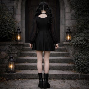 May include: A black long-sleeved dress with a scoop neckline and a flared skirt, paired with black ankle boots. The dress features sheer sleeves with fitted cuffs and a solid bodice. The ensemble is completed by a simple black choker necklace.