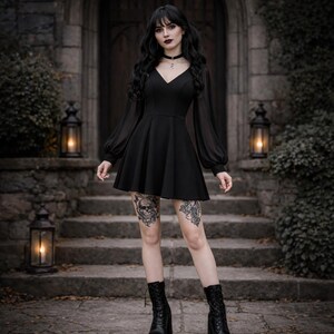 May include: A black mini dress featuring a V-neckline, long sheer bishop sleeves with fitted cuffs, and a flared skirt. The dress is paired with a black choker necklace and black lace-up platform boots, creating a cohesive dark aesthetic.