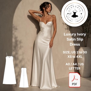 Puede incluir: Vestido lencero de satén marfil con tirantes finos. El vestido es largo hasta el suelo y tiene un diseño fluido. La imagen incluye un logotipo con el texto "Luxury Ivory Satin Slip Dress" e información de tallas.