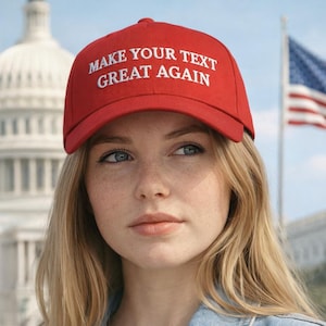 May include: A red baseball cap with the text "MAKE YOUR TEXT GREAT AGAIN" in white. The cap is worn by a person with blonde hair and a denim jacket. The U.S. Capitol building and an American flag are in the background.